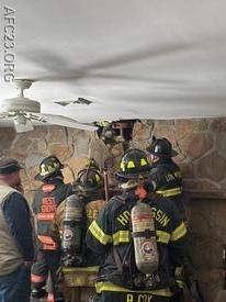 Units work to expose the interior wall on the first floor